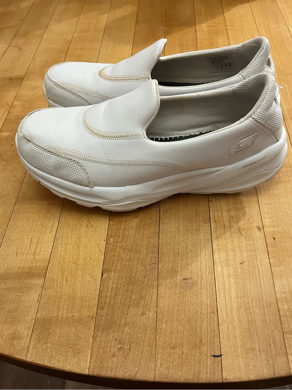 Skechers GO WALK slip-on performance shoes featuring a breathable mesh toe